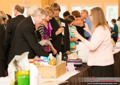 Tuxedo Cat Ball Attendees Looking at Silent Auction Items