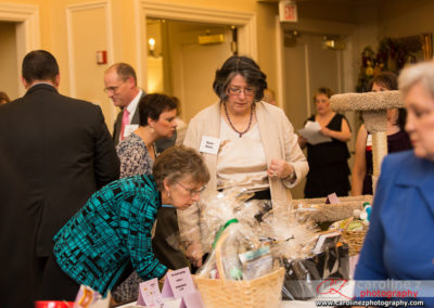 Tuxedo Cat Ball Attendees Looking at Silent Auction Items