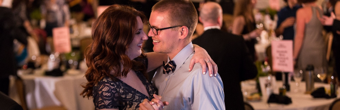 Couple Slow Dancing at Tuxedo Cat Ball