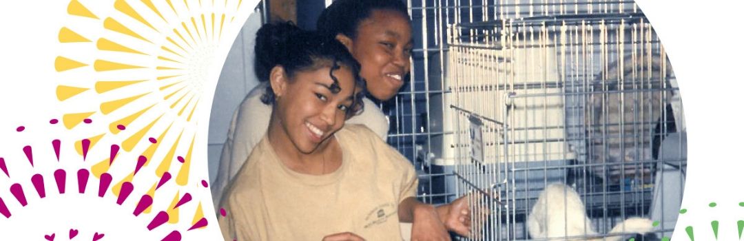 Two Volunteers Cleaning Cat Cages