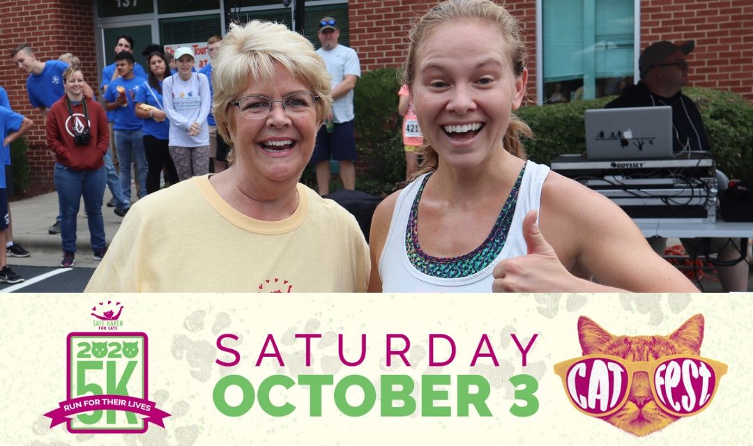 Two Female Runners with Banner Showing Saturday October 3